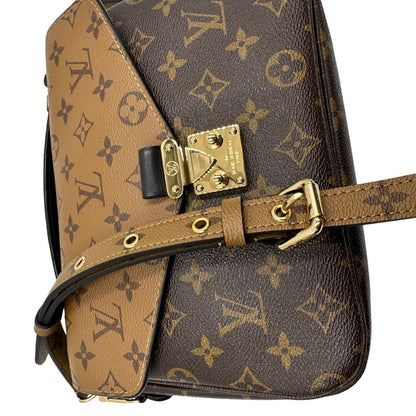 Borsa Louis Vuitton Métis in canvas marrone monogram reverse con parti metalliche dorate; munita di un manico singolo e una tracolla amovibile e regolabile. Completa di scatola, di lusso, originale, ottime condizioni, usata. 