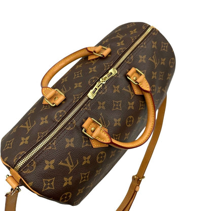 chiusura Borsa Speedy 35 in canvas marrone monogram con finiture in vacchetta naturale e parti metalliche dorate; munita di doppi manici stondati e una tracolla amovibile e regolabile. Completa di corredo, lucchetto e chiavi, di lusso, originale, ottime condizioni. 