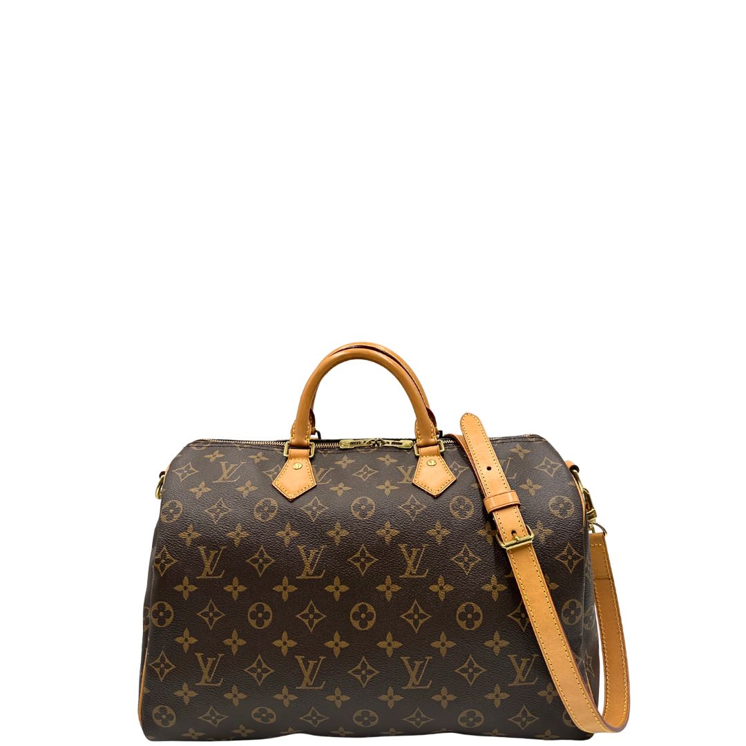 front Borsa Speedy 35 in canvas marrone monogram con finiture in vacchetta naturale e parti metalliche dorate; munita di doppi manici stondati e una tracolla amovibile e regolabile. Completa di corredo, lucchetto e chiavi, di lusso, originale, ottime condizioni. 