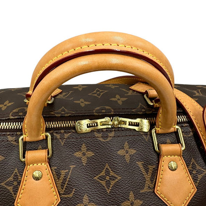 manici Borsa Speedy 35 in canvas marrone monogram con finiture in vacchetta naturale e parti metalliche dorate; munita di doppi manici stondati e una tracolla amovibile e regolabile. Completa di corredo, lucchetto e chiavi, di lusso, originale, ottime condizioni.