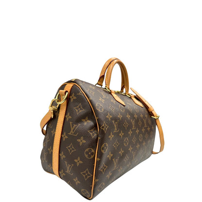 lato Borsa Speedy 35 in canvas marrone monogram con finiture in vacchetta naturale e parti metalliche dorate; munita di doppi manici stondati e una tracolla amovibile e regolabile. Completa di corredo, lucchetto e chiavi, di lusso, originale, ottime condizioni. 