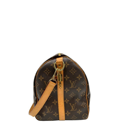 lato Borsa Speedy 35 in canvas marrone monogram con finiture in vacchetta naturale e parti metalliche dorate; munita di doppi manici stondati e una tracolla amovibile e regolabile. Completa di corredo, lucchetto e chiavi, di lusso, originale, ottime condizioni. 