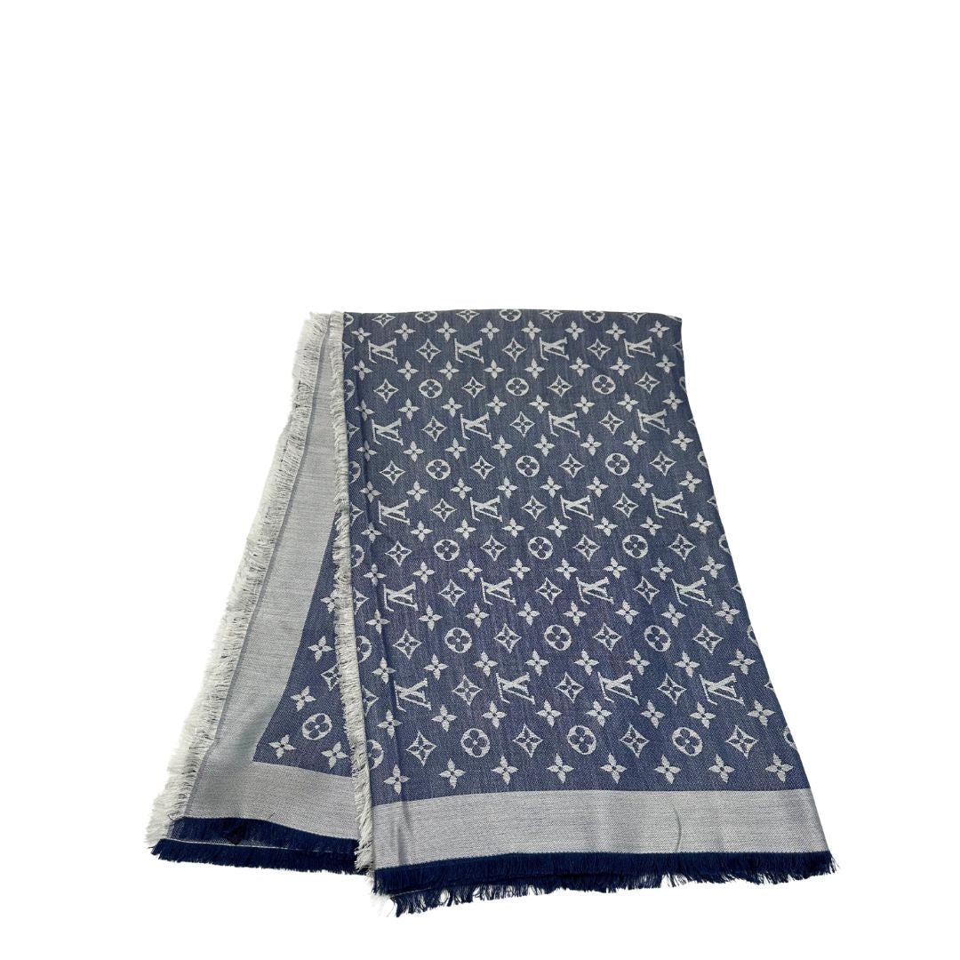 Stola Louis Vuitton in 60% lana e 40% seta bicolore blu e grigio, con trama monogram e bordi sfrangiati. Completa di scatola. Originale, usata, di lusso, in condizioni eccellenti.