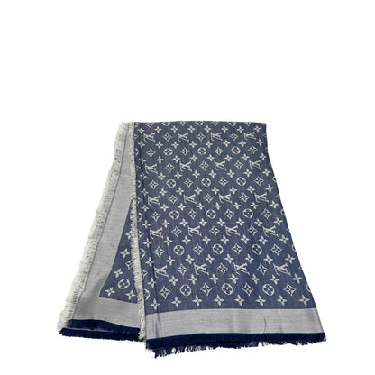 Stola Louis Vuitton in 60% lana e 40% seta bicolore blu e grigio, con trama monogram e bordi sfrangiati. Completa di scatola. Originale, usata, di lusso, in condizioni eccellenti.