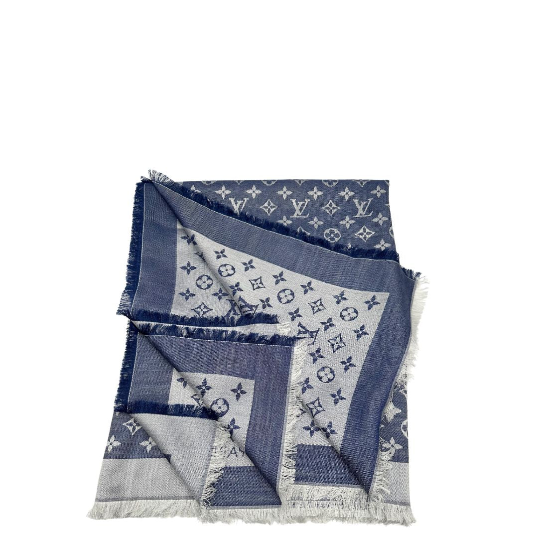 Stola Louis Vuitton in 60% lana e 40% seta bicolore blu e grigio, con trama monogram e bordi sfrangiati. Completa di scatola. Originale, usata, di lusso, in condizioni eccellenti.