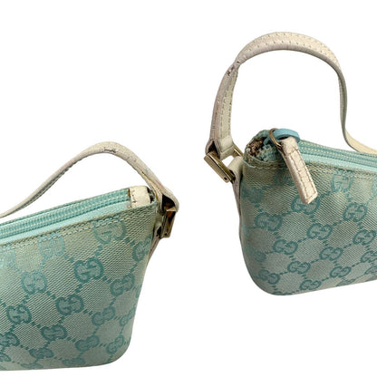 angoli  Borsa Gucci in tessuto celeste GG con finiture in pelle bianche e parti metalliche dorate, munita di un manico singolo, di lusso, originale, ottime condizioni. 