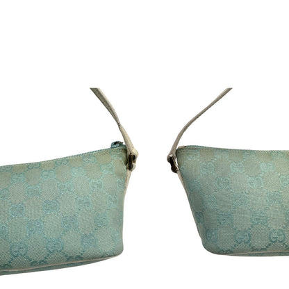 angoli  Borsa Gucci in tessuto celeste GG con finiture in pelle bianche e parti metalliche dorate, munita di un manico singolo, di lusso, originale, ottime condizioni. 