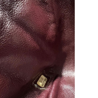 interno Borsa Chanel in pelle matelassé nera con tracolla scorrevole in catena e pelle intrecciate, con parti metalliche dorate. Indossabile a spalla oppure a tracolla, di lusso, originale, ottime condizioni, usata. 