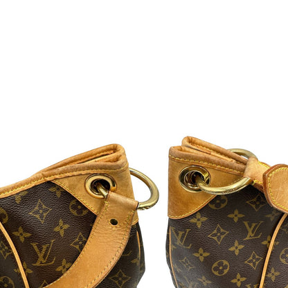 angoli superiori Borsa Louis Vuitton in canvas marrone monogram con finiture in vacchetta naturale e parti metalliche dorate; munita di un manico singolo leggermente regolabile, di lusso, originale, ottime condizioni, usata. 