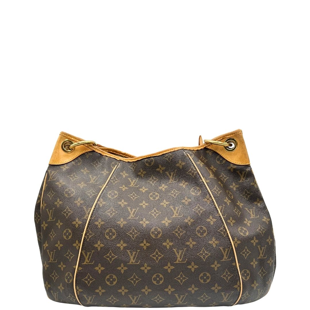 retro Borsa Louis Vuitton in canvas marrone monogram con finiture in vacchetta naturale e parti metalliche dorate; munita di un manico singolo leggermente regolabile, di lusso, originale, ottime condizioni, usata. 