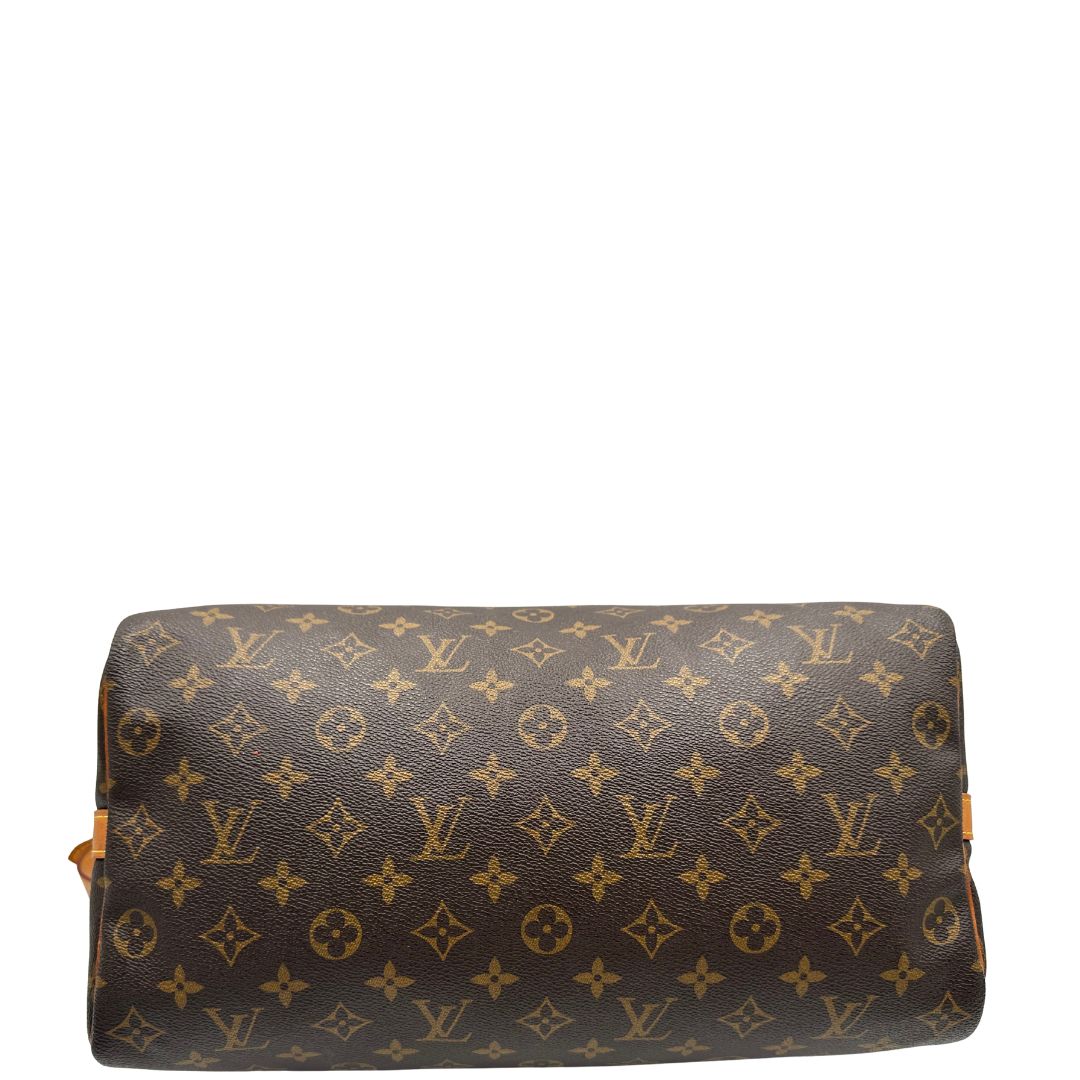 base Borsa Speedy 35 in canvas marrone monogram con finiture in vacchetta naturale e parti metalliche dorate; munita di doppi manici stondati e una tracolla amovibile e regolabile. Completa di lucchetto e dustbag, di lusso, originale, ottime condizioni. 