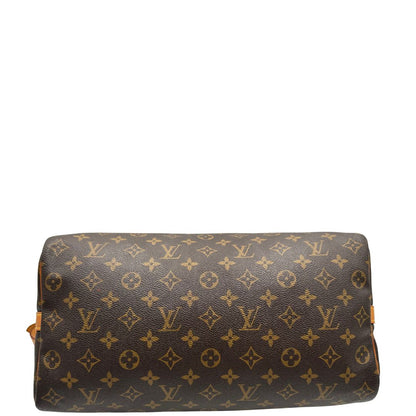 base Borsa Speedy 35 in canvas marrone monogram con finiture in vacchetta naturale e parti metalliche dorate; munita di doppi manici stondati e una tracolla amovibile e regolabile. Completa di lucchetto e dustbag, di lusso, originale, ottime condizioni. 