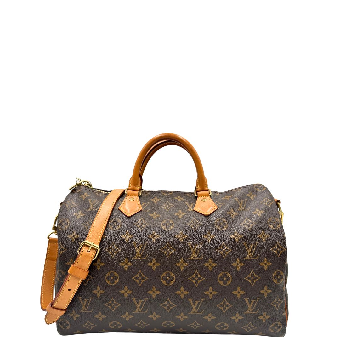 front Borsa Speedy 35 in canvas marrone monogram con finiture in vacchetta naturale e parti metalliche dorate; munita di doppi manici stondati e una tracolla amovibile e regolabile. Completa di lucchetto e dustbag, di lusso, originale, ottime condizioni. 