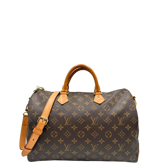 front Borsa Speedy 35 in canvas marrone monogram con finiture in vacchetta naturale e parti metalliche dorate; munita di doppi manici stondati e una tracolla amovibile e regolabile. Completa di lucchetto e dustbag, di lusso, originale, ottime condizioni. 