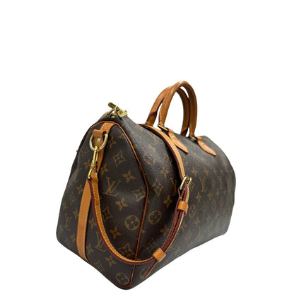 lato Borsa Speedy 35 in canvas marrone monogram con finiture in vacchetta naturale e parti metalliche dorate; munita di doppi manici stondati e una tracolla amovibile e regolabile. Completa di lucchetto e dustbag, di lusso, originale, ottime condizioni. 