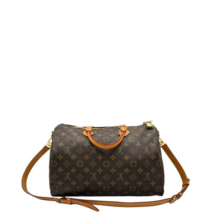 retro Borsa Speedy 35 in canvas marrone monogram con finiture in vacchetta naturale e parti metalliche dorate; munita di doppi manici stondati e una tracolla amovibile e regolabile. Completa di lucchetto e dustbag, di lusso, originale, ottime condizioni. 