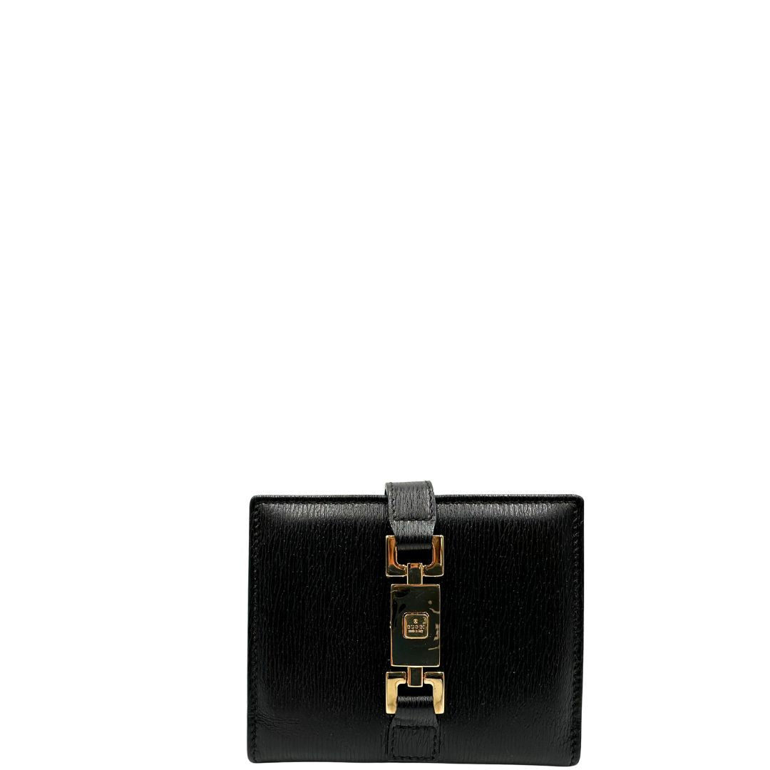Agenda Gucci in pelle nera con parti metalliche dorate, munita di un pennino, di lusso, originale