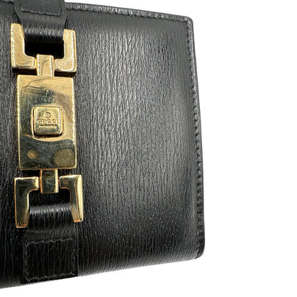 Agenda Gucci in pelle nera con parti metalliche dorate, munita di un pennino, di lusso, originale