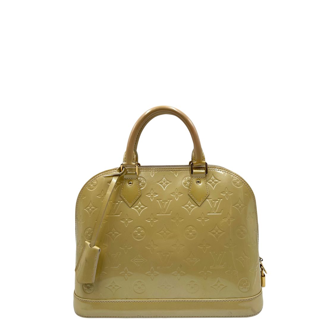 front Alma PM Louis Vuitton in pelle Vernis color noisette con parti metalliche dorate e doppi manici stondati; da portare a mano. Completa di dustbag, lucchetto e chiavi, di lusso, originale, ottime condizioni, usata. 