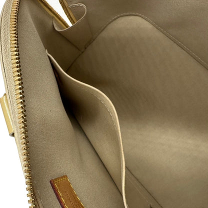 interno Alma PM Louis Vuitton in pelle Vernis color noisette con parti metalliche dorate e doppi manici stondati; da portare a mano. Completa di dustbag, lucchetto e chiavi, di lusso, originale, ottime condizioni, usata. 