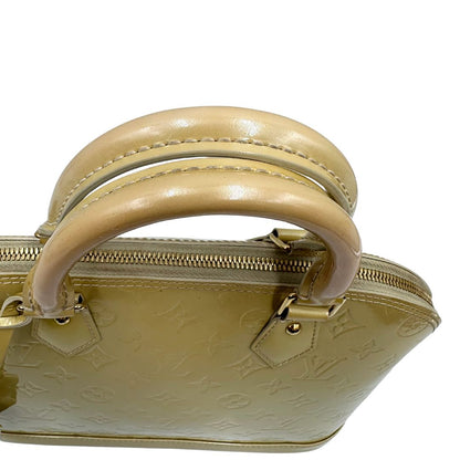 manici Alma PM Louis Vuitton in pelle Vernis color noisette con parti metalliche dorate e doppi manici stondati; da portare a mano. Completa di dustbag, lucchetto e chiavi, di lusso, originale, ottime condizioni, usata. 