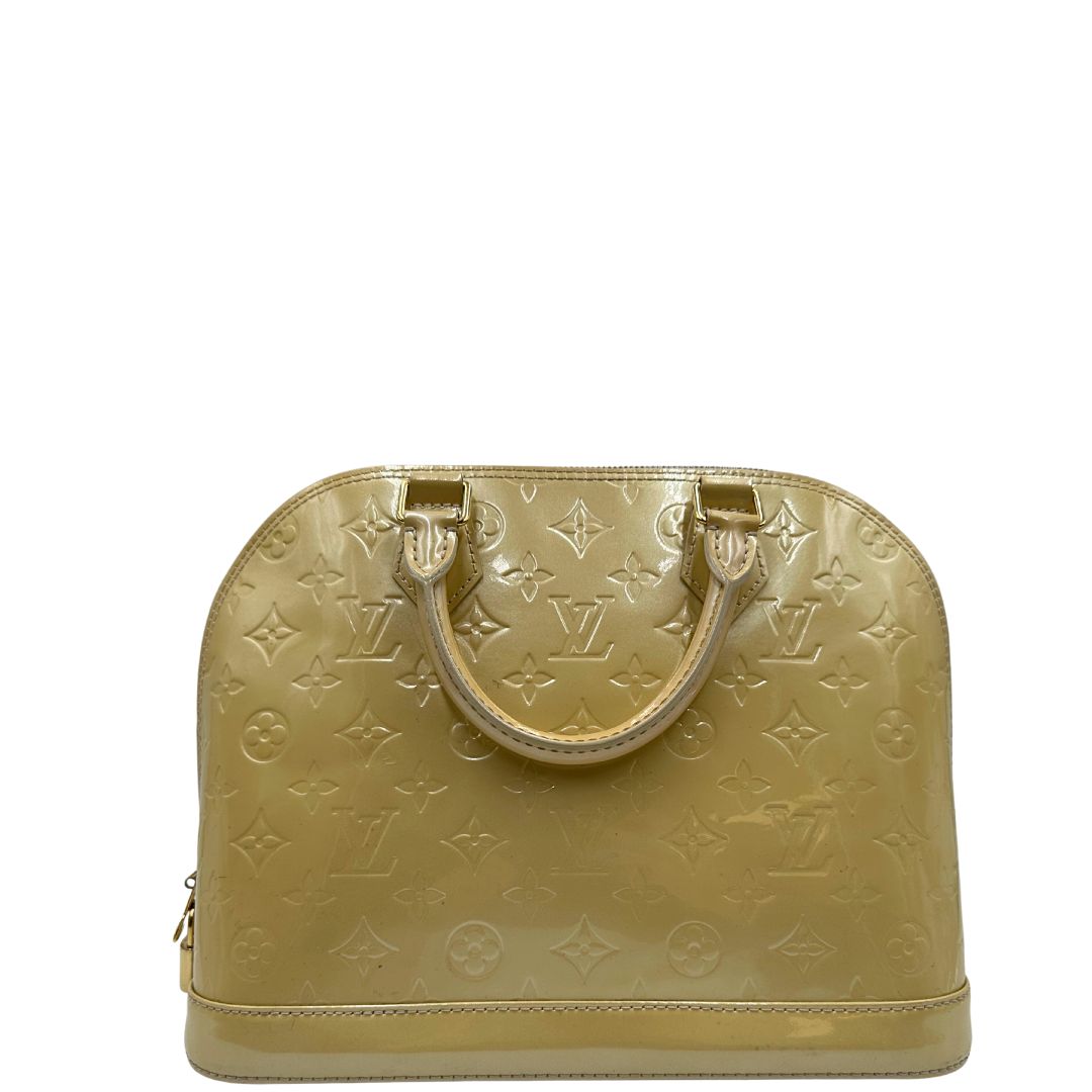 retro Alma PM Louis Vuitton in pelle Vernis color noisette con parti metalliche dorate e doppi manici stondati; da portare a mano. Completa di dustbag, lucchetto e chiavi, di lusso, originale, ottime condizioni, usata. 