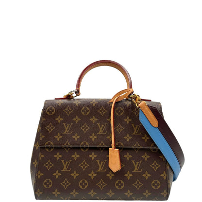 front Borsa Louis Vuitton in canvas marrone monogram con finiture in vacchetta naturale e parti metalliche dorate; munita di un manico singolo e una tracolla bicolore, blu e marrone, amovibile. Completa di scatola, di lusso, originale, ottime condizioni. 