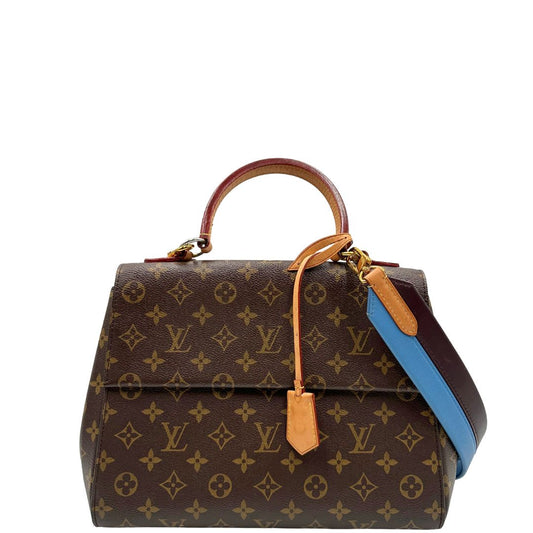 front Borsa Louis Vuitton in canvas marrone monogram con finiture in vacchetta naturale e parti metalliche dorate; munita di un manico singolo e una tracolla bicolore, blu e marrone, amovibile. Completa di scatola, di lusso, originale, ottime condizioni. 