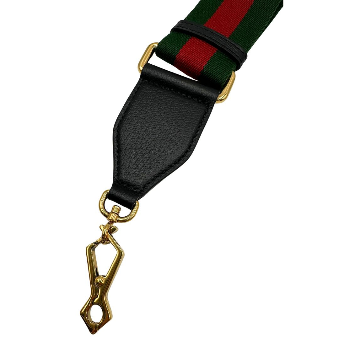 Tracolla Gucci in tessuto con iconica striscia web verde e rossa, con parti in pelle nera e parti metalliche dorate, di lusso, eccellenti condizioni.