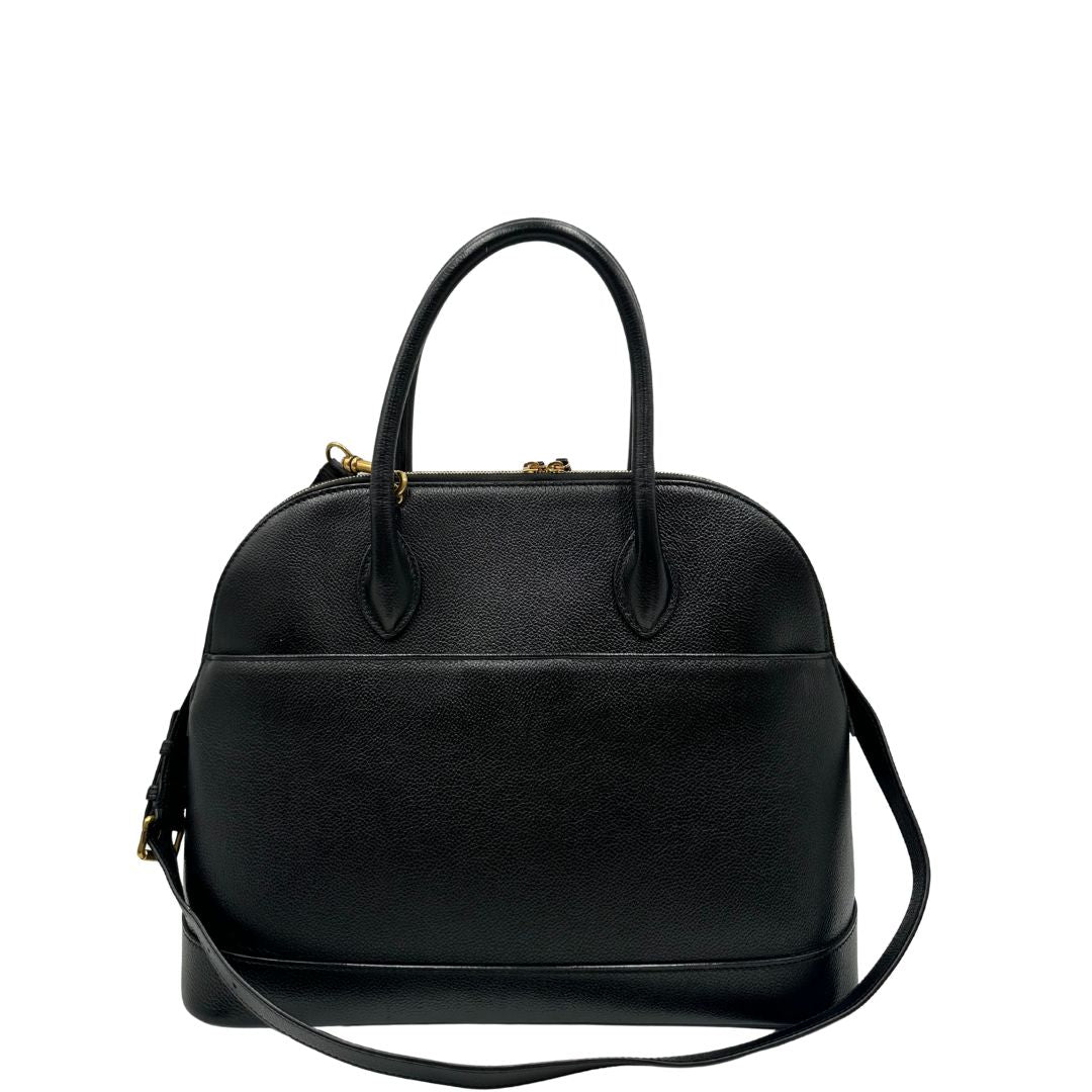 Retro di una Borsa Balenciaga in pelle martellata nera con parti metalliche dorate, munita di doppi manici e una tracolla amovibile e regolabile. Completa di dustbag e cartellini, lucchetto e chiavi. Originale, usata, di lusso, in ottime condizioni.