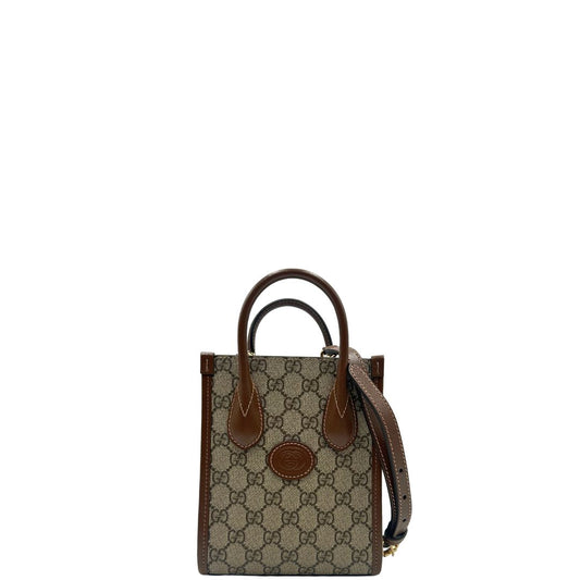 front Borsa Gucci in canvas beige GG con finiture in pelle marroni e parti metalliche dorate; munita di doppi manici stondati e una tracolla amovibile e regolabile. Completa di dustbag, di lusso, originale, ottime condizioni, usata. 
