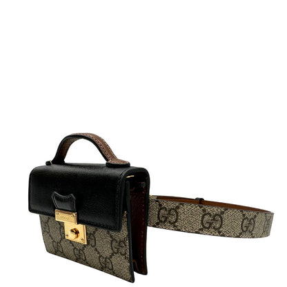 lato Mini marsupio Gucci in canvas GG beige con finiture in pelle nere e marroni e parti metalliche dorate. Completo di dustbag, eccellenti condizioni, usato, originale. 