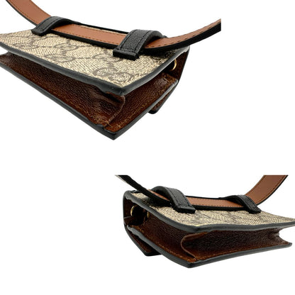 angoli Mini marsupio Gucci in canvas GG beige con finiture in pelle nere e marroni e parti metalliche dorate. Completo di dustbag, eccellenti condizioni, usato, originale. 