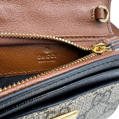 interno  Mini marsupio Gucci in canvas GG beige con finiture in pelle nere e marroni e parti metalliche dorate. Completo di dustbag, eccellenti condizioni, usato, originale.