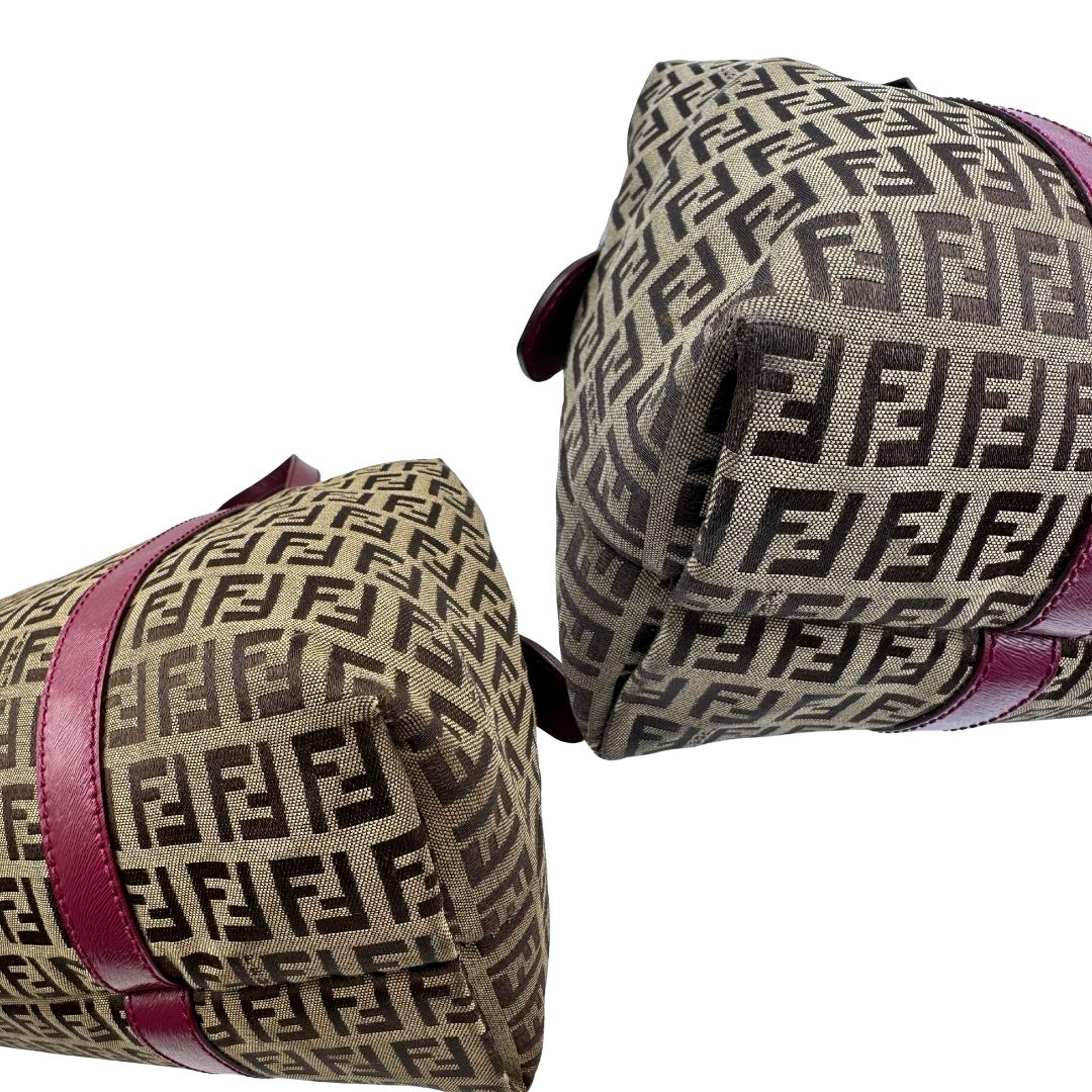 angoli Borsa Fendi in tessuto color tabacco trama Zucchino con finiture in pelle color amaranto e parti metalliche dorate; munita di doppi manici, da portare a spalla, di lusso, buone condizioni, originale. 