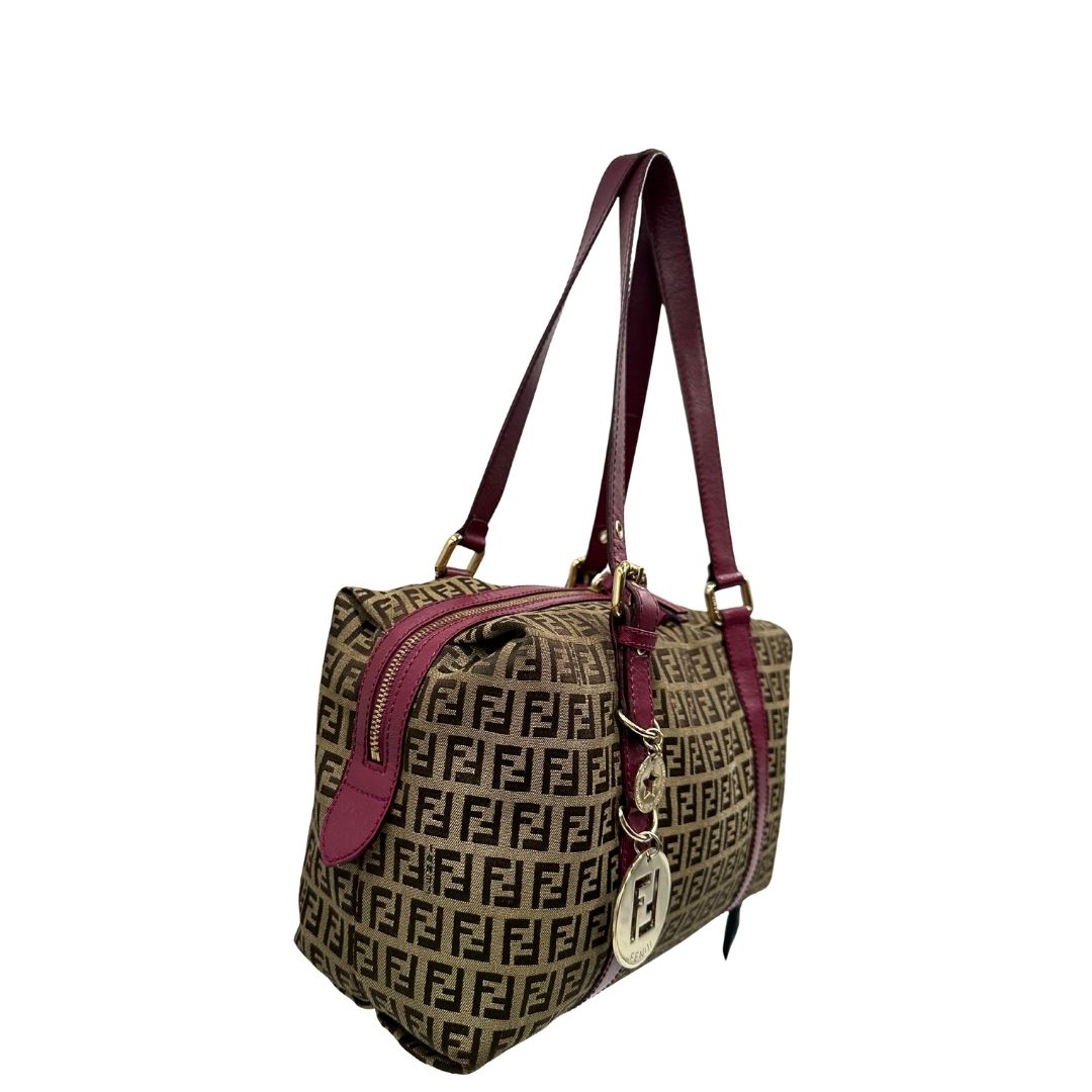 lato Borsa Fendi in tessuto color tabacco trama Zucchino con finiture in pelle color amaranto e parti metalliche dorate; munita di doppi manici, da portare a spalla, di lusso, buone condizioni, originale. 