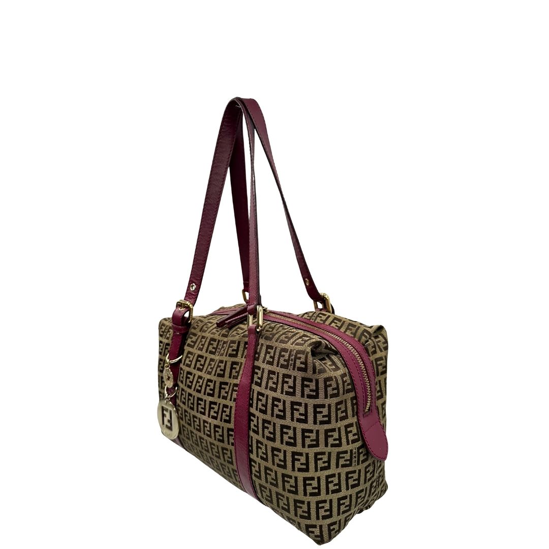 lato Borsa Fendi in tessuto color tabacco trama Zucchino con finiture in pelle color amaranto e parti metalliche dorate; munita di doppi manici, da portare a spalla, di lusso, buone condizioni, originale. 