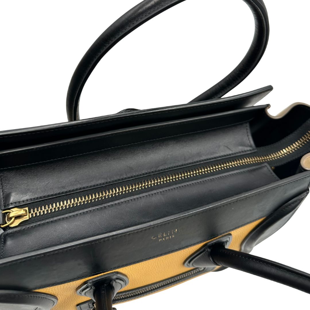 interno Borsa Céline Luggage in pelle multicolr nera, gialla e laterali in pelle scamosciata beige, con parti metalliche dorate e doppi manici stondati. Completa di dustbag, di lusso, originale, ottime condizioni, usata. 