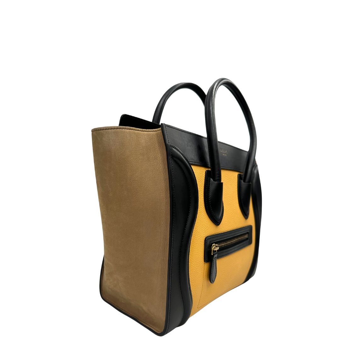 lato Borsa Céline Luggage in pelle multicolr nera, gialla e laterali in pelle scamosciata beige, con parti metalliche dorate e doppi manici stondati. Completa di dustbag, di lusso, originale, ottime condizioni, usata. 