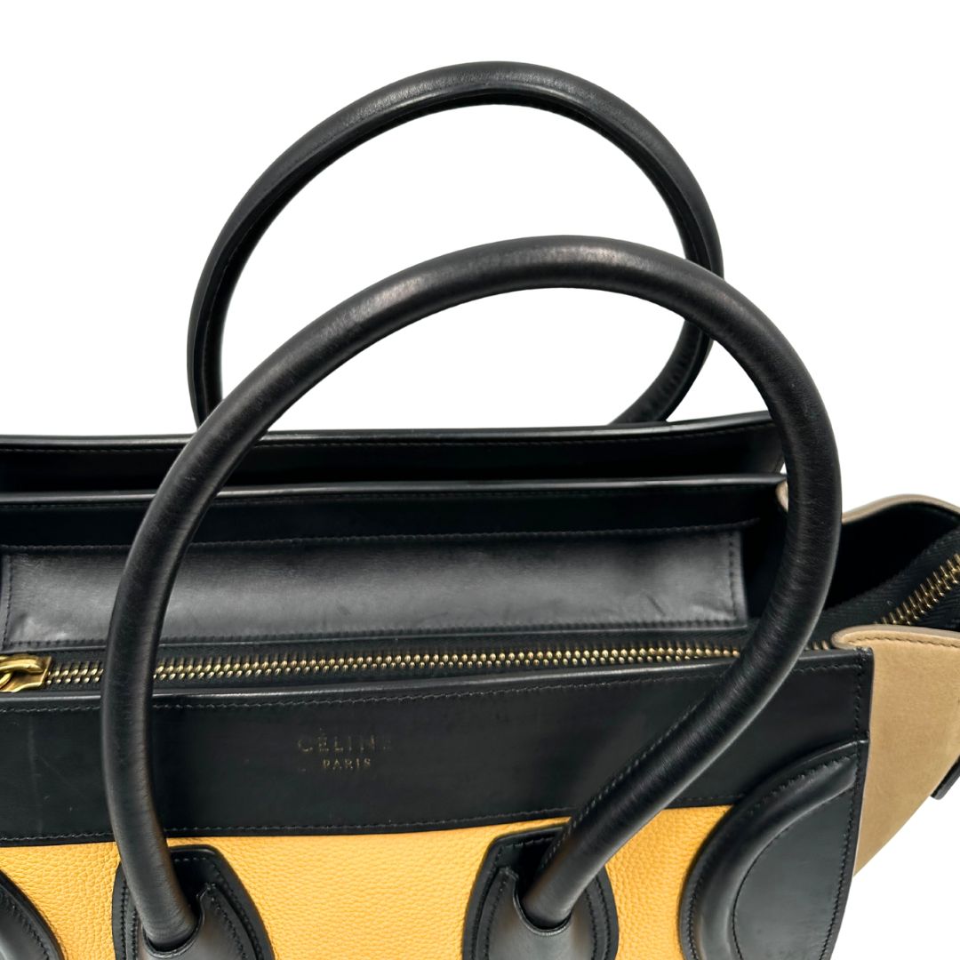 manici Borsa Céline Luggage in pelle multicolr nera, gialla e laterali in pelle scamosciata beige, con parti metalliche dorate e doppi manici stondati. Completa di dustbag, di lusso, originale, ottime condizioni, usata. 