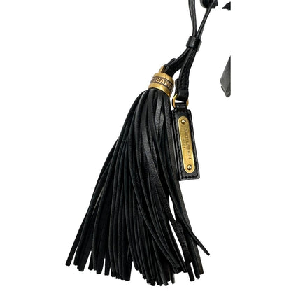 nappa Marsupio Saint Laurent in pelle nera trapuntata con parti metalliche dorate; impreziosita da nappa decorativa amovibile e logo Cassandre sul front; indossabile anche a tracolla. Completo di dustbag, di lusso, originale, ottime condizioni, usato. 