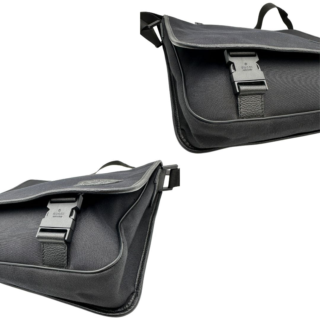 angoli Borsa Gucci in tessuto nero con finiture in pelle tono su tono; munita di una tracolla in tessuto regolabile, di lusso, originale, ottime condizioni, usata. 