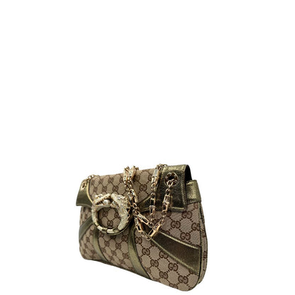 lato  Borsa Gucci in tessuto GG beige con finiture in pelle e parti metalliche dorate; munita di doppi manici in catena, indossabile a spalla, di lusso, originale, ottime condizioni, usata. 