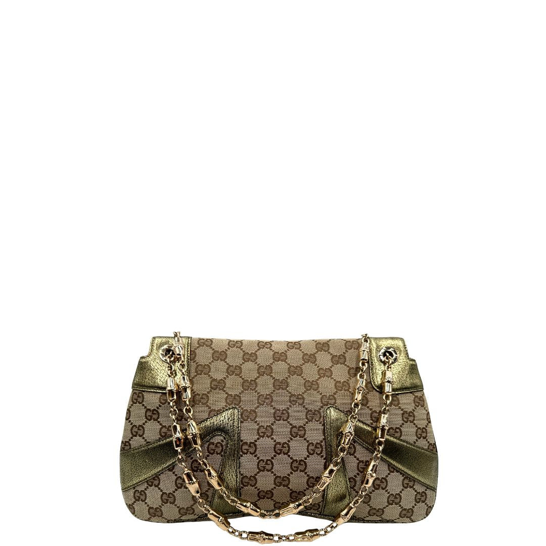 retro  Borsa Gucci in tessuto GG beige con finiture in pelle e parti metalliche dorate; munita di doppi manici in catena, indossabile a spalla, di lusso, originale, ottime condizioni, usata. 