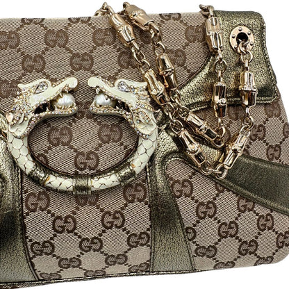  Borsa Gucci in tessuto GG beige con finiture in pelle e parti metalliche dorate; munita di doppi manici in catena, indossabile a spalla, di lusso, originale, ottime condizioni, usata. 