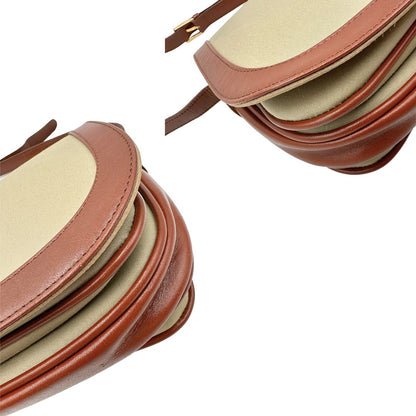 angoli Borsa Burberry in tessuto con finiture color cognac e parti metalliche dorate; munita di una tracolla regolabile, di lusso, originale, ottime condizioni. 