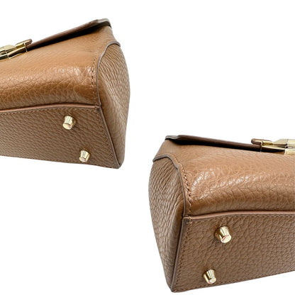 angoli  Borsa Furla in pelle martellata marrone e parti metalliche dorate; munita di un manico singolo e una tracolla regolabile. Completa di dustbag, di lusso, originale, ottime condizioni, usata. 