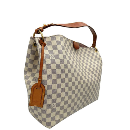 lato Borsa Louis Vuitton in canvas damier azur con finiture in vacchetta naturale e parti metalliche dorate; munita di un manico singolo, indossabile a spalla, di lusso, originale, ottime condizioni, usata. 