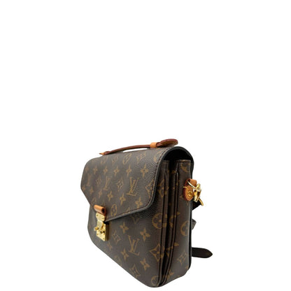 lato Borsa Louis Vuitton Métis in canvas marrone monogram con dettagli in vacchetta naturale e parti metalliche dorate. Munita di un manico singolo e una tracolla regolabile e amovibile, di lusso, originale, ottime condizioni, usata. 