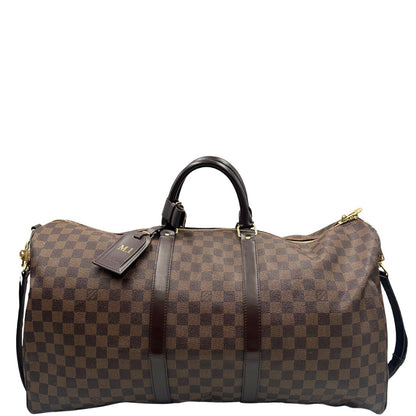 Borsone Louis Vuitton in canvas Damier Ébène marrone con finiture in pelle tono su tono e parti metalliche dorate; munito di doppi manici stondati e una tracolla amovibile e regolabile. Completo di lucchetto, chiavi e dustbag, di lusso, originale, ottime condizioni, usato.